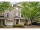 Brick townhome featuring attached garages and manicured landscaping at 3317 Regent Sw Pl, Atlanta, GA 30311