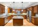 Gourmet kitchen with wooden cabinets, stainless steel appliances, and granite countertops at 3317 Regent Sw Pl, Atlanta, GA 30311