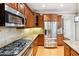 Well-equipped kitchen features stainless steel appliances and warm wood cabinetry at 3317 Regent Sw Pl, Atlanta, GA 30311
