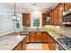 Gourmet kitchen with custom cabinetry, granite counters, and stainless appliances at 3317 Regent Sw Pl, Atlanta, GA 30311