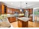 Spacious kitchen featuring an island, stainless steel appliances and warm wood cabinetry at 3317 Regent Sw Pl, Atlanta, GA 30311
