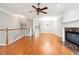 Spacious living room features hardwood floors, fireplace, and stairs to the second level at 3317 Regent Sw Pl, Atlanta, GA 30311