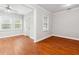 A living room shows hardwood floors, a ceiling fan, and an exterior door at 3317 Regent Sw Pl, Atlanta, GA 30311