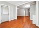 A living room shows hardwood floors, and a doorway leading to another room at 3317 Regent Sw Pl, Atlanta, GA 30311