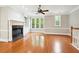 Spacious living room features hardwood floors, a fireplace, and natural light from large windows at 3317 Regent Sw Pl, Atlanta, GA 30311