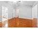Light-filled main bedroom featuring hardwood floors, an ensuite bathroom and walk-in closet at 3317 Regent Sw Pl, Atlanta, GA 30311