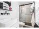 Stylish bathroom with a glass enclosed shower, black fixtures, and a modern vessel sink at 403 Red Oak Ln, Lawrenceville, GA 30046