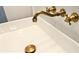 Close-up of a modern white bathroom sink with bronze hardware at 403 Red Oak Ln, Lawrenceville, GA 30046