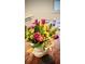 Fresh cut flowers on kitchen island next to dark colored condiment jar at 403 Red Oak Ln, Lawrenceville, GA 30046
