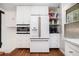 Bright, eat in kitchen with white appliances and ample storage in custom cabinets at 403 Red Oak Ln, Lawrenceville, GA 30046