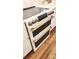 Modern kitchen oven featuring stainless steel accents, a sleek design, and hardwood flooring at 403 Red Oak Ln, Lawrenceville, GA 30046