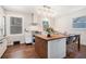 Newly renovated kitchen boasts an eat-in island and modern appliances with plenty of natural light at 403 Red Oak Ln, Lawrenceville, GA 30046