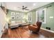 Inviting living room featuring a comfortable couch, stylish accent chair, and natural light at 403 Red Oak Ln, Lawrenceville, GA 30046