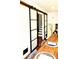 View into the foyer of the home through sliding doors from the kitchen at 403 Red Oak Ln, Lawrenceville, GA 30046