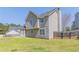Lush backyard showcasing the home's exterior, offering a scenic outdoor living space at 705 Brentwood Pkwy, Stockbridge, GA 30281