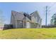 Spacious backyard featuring a well-maintained lawn and sturdy wooden fence, perfect for outdoor activities and privacy at 705 Brentwood Pkwy, Stockbridge, GA 30281