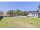 Expansive backyard with lush greenery and privacy fence, perfect for Gathering activities at 705 Brentwood Pkwy, Stockbridge, GA 30281