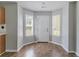 Cozy breakfast area is lit by natural light from the surrounding windows and a door at 705 Brentwood Pkwy, Stockbridge, GA 30281