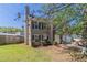 View of a two-story home showcasing a fenced yard, siding, and an attached two-car garage at 705 Brentwood Pkwy, Stockbridge, GA 30281