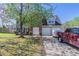 Charming two-story home featuring a two-car garage, brick accents, and a well-manicured lawn at 705 Brentwood Pkwy, Stockbridge, GA 30281