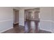 Spacious living room with hardwood floors and neutral paint, showcasing an open floor plan at 705 Brentwood Pkwy, Stockbridge, GA 30281