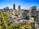 Wonderful aerial view of property surrounded by lush trees with city skyline views at 850 Piedmont Ne Ave # 1206, Atlanta, GA 30308