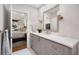 Modern bathroom featuring quartz countertops, framed mirror and views to primary bedroom at 850 Piedmont Ne Ave # 1206, Atlanta, GA 30308