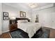 Well-lit bedroom with plush bed, accent rug, and neutral wall color palette at 850 Piedmont Ne Ave # 1206, Atlanta, GA 30308