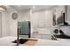 Bright kitchen boasts white cabinets, stainless steel appliances, and a sleek faucet at 850 Piedmont Ne Ave # 1206, Atlanta, GA 30308