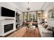 Bright living room with a fireplace, large windows, and elegant furnishings at 850 Piedmont Ne Ave # 1206, Atlanta, GA 30308