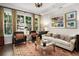 Bright living room with large windows and ample seating at 850 Piedmont Ne Ave # 1206, Atlanta, GA 30308