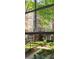Outside view of the community with walking path, lush greenery, and blooming trees at 850 Piedmont Ne Ave # 1206, Atlanta, GA 30308