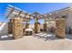 Outdoor patio featuring a stone fireplace, pergola, and seating at 850 Piedmont Ne Ave # 1206, Atlanta, GA 30308