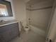 A bathroom featuring a vanity with marble top, toilet and tiled shower/tub combination at 1315 Old Coach Sw Rd, Marietta, GA 30008