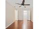 Bedroom with hardwood floors, a ceiling fan, and natural light from the window at 1315 Old Coach Sw Rd, Marietta, GA 30008
