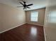 A clean and bright bedroom with hardwood floors and a window providing natural light at 1315 Old Coach Sw Rd, Marietta, GA 30008