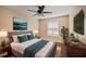 Well-lit bedroom featuring a comfortable bed with modern furnishings and a ceiling fan at 1315 Old Coach Sw Rd, Marietta, GA 30008