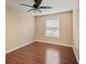 Bedroom with hardwood floors, a window that provides natural light, and a ceiling fan at 1315 Old Coach Sw Rd, Marietta, GA 30008