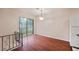 Dining room with hardwood floors, a sliding glass door leading to a deck, and a modern light fixture at 1315 Old Coach Sw Rd, Marietta, GA 30008