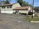 A multi-unit residential building with parking spaces and green lawns at 1315 Old Coach Sw Rd, Marietta, GA 30008