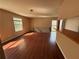 Bright and airy living room featuring hardwood floors, large windows, and an open layout perfect for entertaining at 1315 Old Coach Sw Rd, Marietta, GA 30008