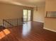 Open-concept living room featuring beautiful floors, natural light, and easy access to the balcony at 1315 Old Coach Sw Rd, Marietta, GA 30008