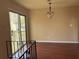 Cozy living room showcasing a sliding glass door that opens to the balcony and lets in ample natural light at 1315 Old Coach Sw Rd, Marietta, GA 30008