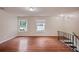 Open living room with hardwood floors and many windows at 1315 Old Coach Sw Rd, Marietta, GA 30008
