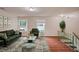 Spacious living room with lots of natural light, modern furniture, and hardwood floors at 1315 Old Coach Sw Rd, Marietta, GA 30008