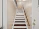 View of a staircase with wooden steps and a wooden handrail at 1315 Old Coach Sw Rd, Marietta, GA 30008