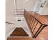 View of a staircase with metal railing and wood steps at 1315 Old Coach Sw Rd, Marietta, GA 30008