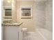 Clean bathroom featuring marble floors, modern vanity, and shower at 1907 Oak Valley Rd, Decatur, GA 30035