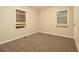 Calm bedroom with plush carpet, neutral walls, and bright windows at 1907 Oak Valley Rd, Decatur, GA 30035