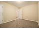 Neutral bedroom features plush carpet and a connecting door at 1907 Oak Valley Rd, Decatur, GA 30035